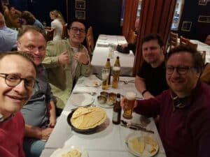 5 deltasquad members enjoying a curry to celebrate Deltabase's 4th birthday